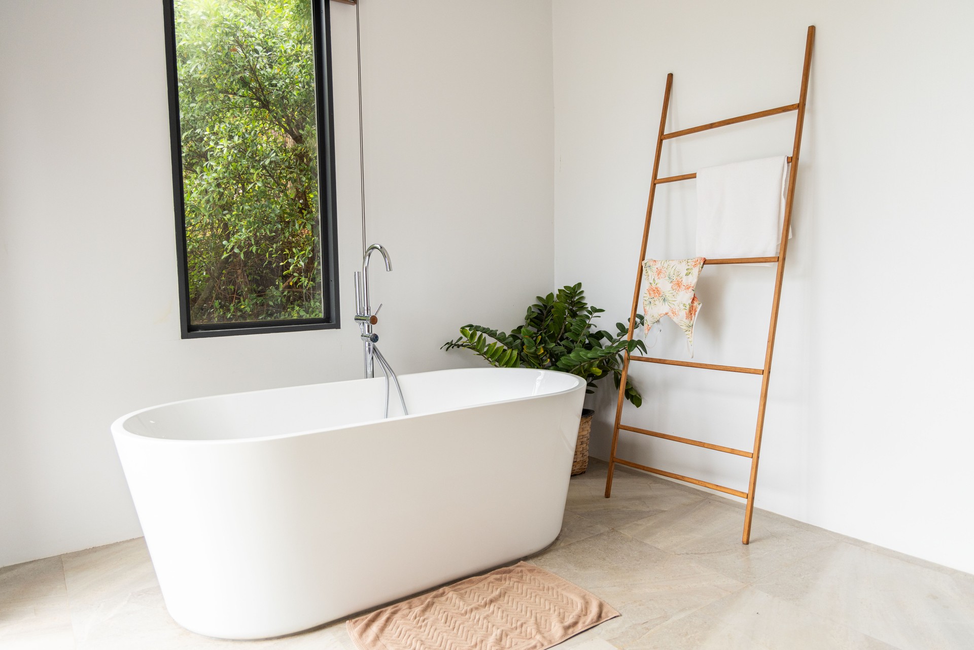 Modern Bathroom with Freestanding Tub and Wooden Ladder Rack